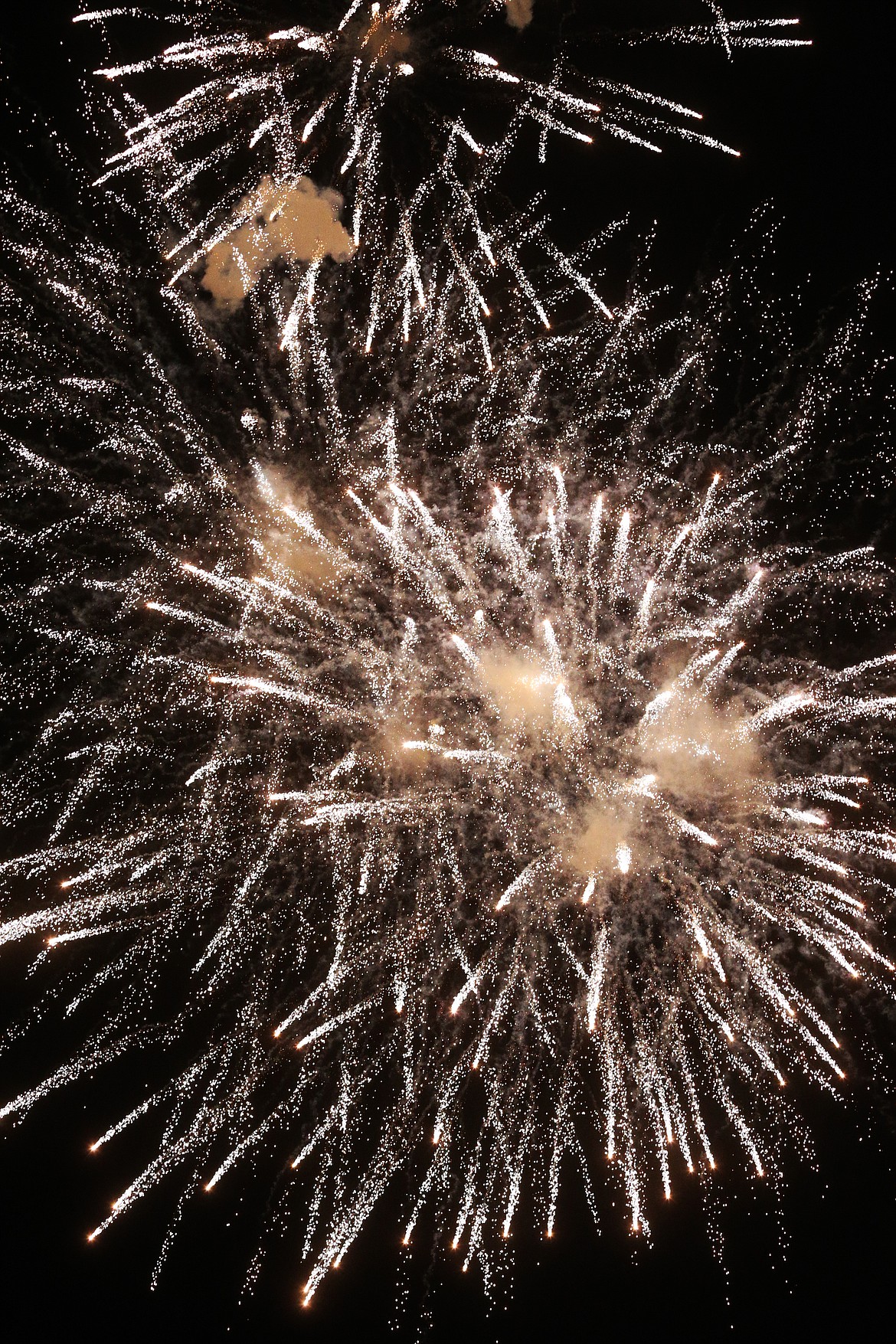 Fireworks explode in the sky after a Post Falls High football score against Lakeland.