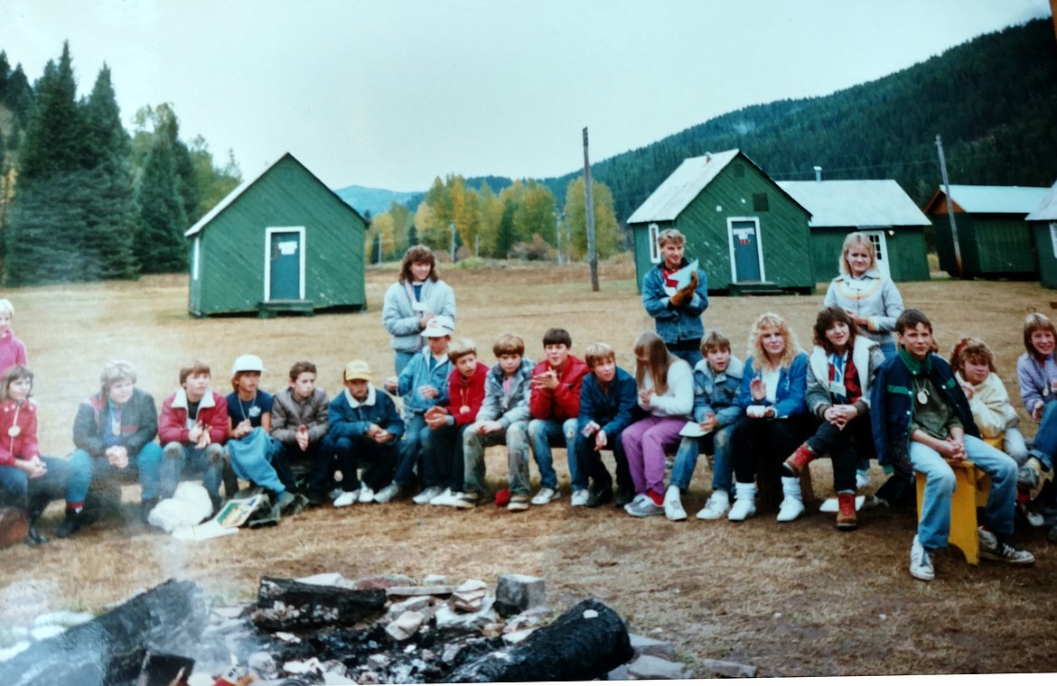 A group of Trail Creek campers sit around a campfire at the original Camp Magee in 1986. Trail Creek, now held at Camp Lutherhaven on Mica Bay, has been a tradition for sixth-graders in the Coeur d'Alene School District since 1973. (Courtesy photo)