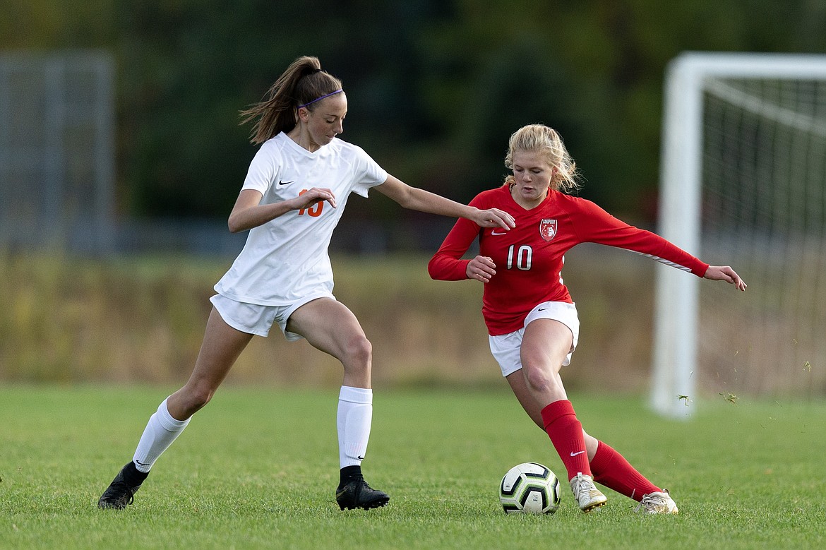 (Photo courtesy of JASON DUCHOW PHOTOGRAPHY)
Freshman Kelsey Cessna tries to fight past a Post Falls defender during the second half Tuesday.