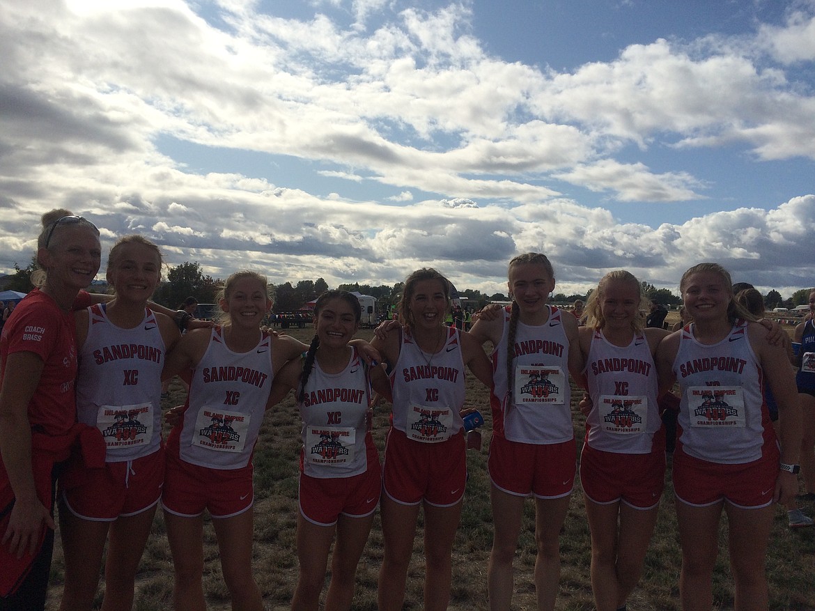 Courtesy photo
The Sandpoint girls cross country team won the team title at the Inland Empire Classic in Lewiston. From left are coach Angie Brass, Ara Clark, Paige Davidson, Bionce Vincent, Megan Oulman, Jillian Primgaard, Mackenzie Suhr-Gregoire and Maddie Morgan.