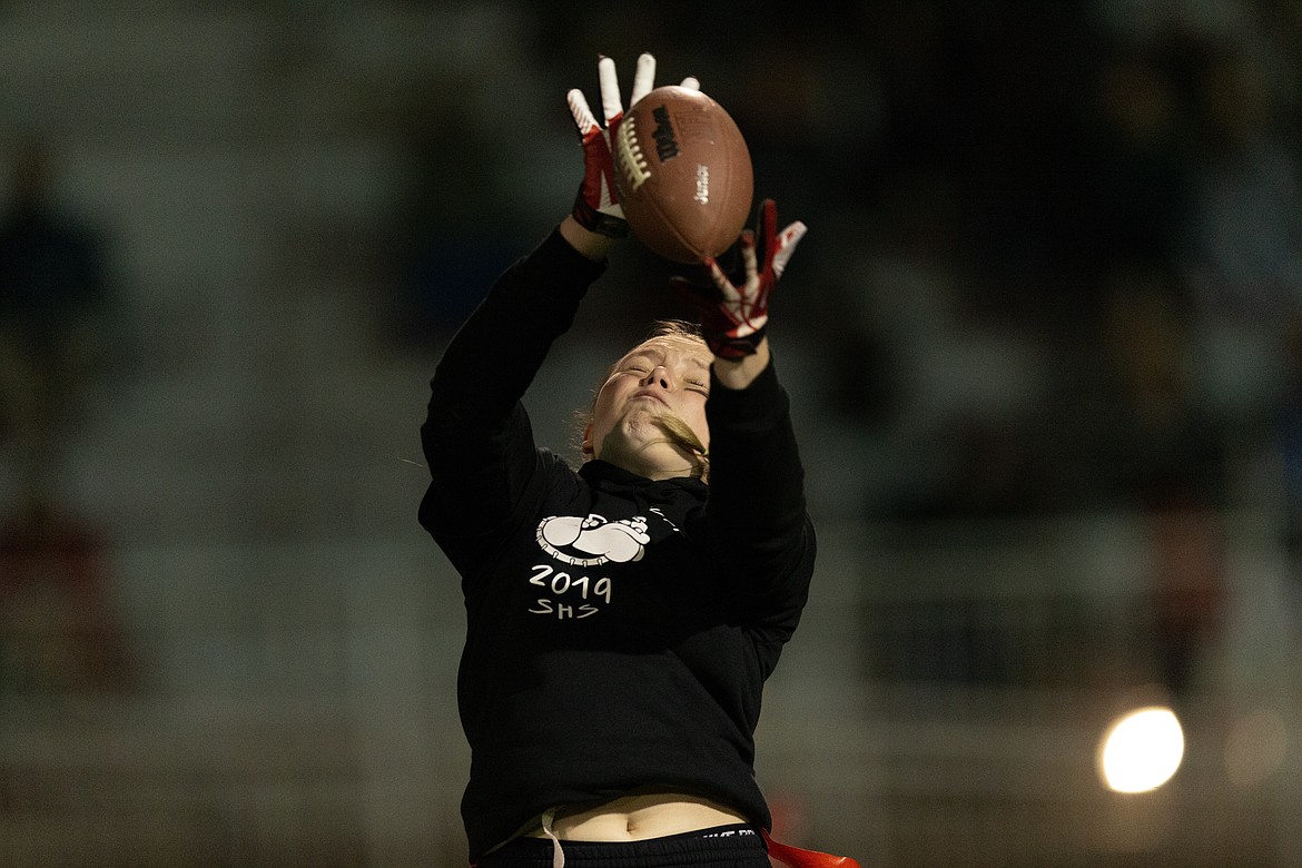 (Photo courtesy of JASON DUCHOW PHOTOGRAPHY)
Savannah Morgan makes a leaping grab for the seniors during the powderpuff championship game against the juniors Wednesday night. The seniors took down the juniors 21-6 to capture their fourth straight victory in the annual homecoming flag football game and finish their careers undefeated. Sandpoint will host Lake City for the Homecoming game 7 p.m. Friday at Memorial Field.