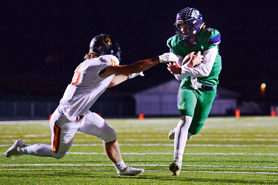 Glacier quarterback JT Allen (3) scores on a 5-yard touchdown run in the second quarter against Missoula Hellgate at Legends Stadium on Friday. Glacier won, 35-28. (Casey Kreider/Daily Inter Lake)