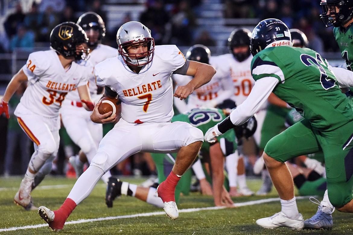 Missoula Hellgate quarterback Rollie Worster (7) looks for running room against Glacier at Legends Stadium on Friday. (Casey Kreider/Daily Inter Lake)