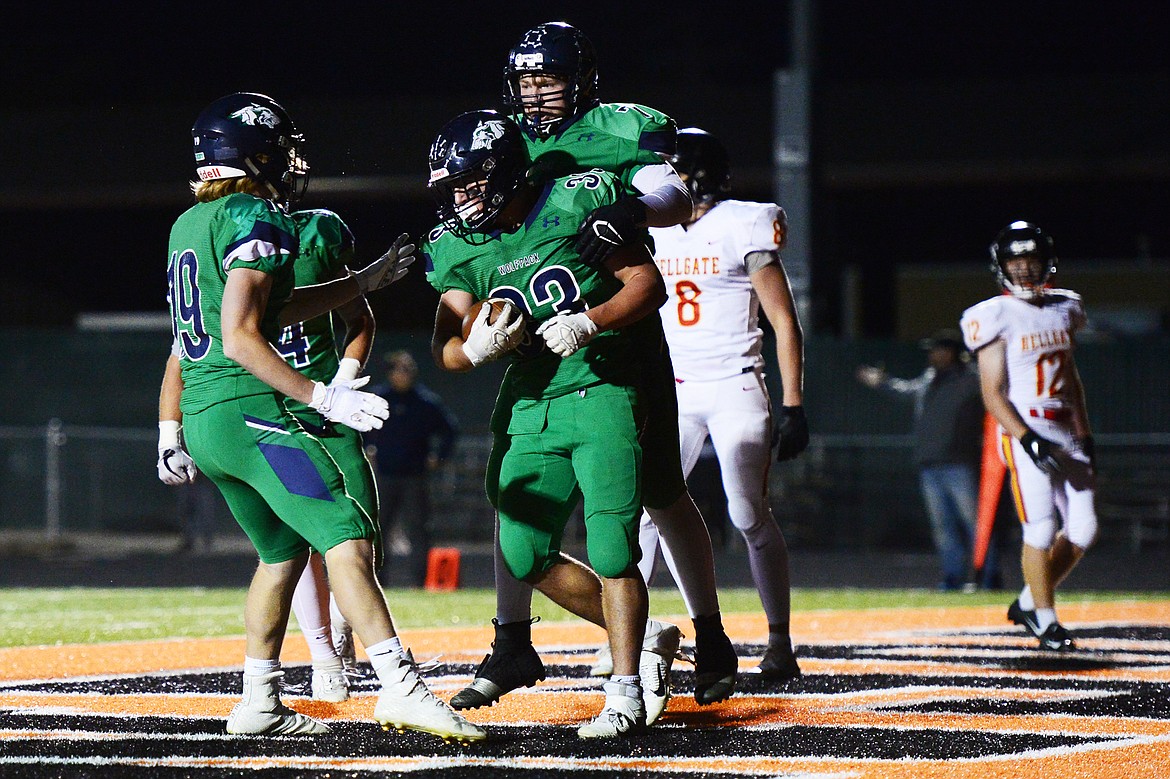 Glacier celebrates with running back Jake Rendina (33) after Rendina&#146;s fourth-quarter touchdown put the Wolfpack up 35-28 against Missoula Hellgate at Legends Stadium on Friday. (Casey Kreider/Daily Inter Lake)