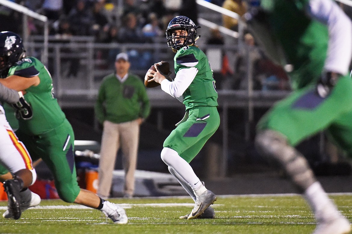 Glacier quarterback JT Allen (3) readies a first-quarter touchdown pass to wide receiver Colin Bowden against Missoula Hellgate at Legends Stadium on Friday. Glacier won, 35-28. (Casey Kreider/Daily Inter Lake)