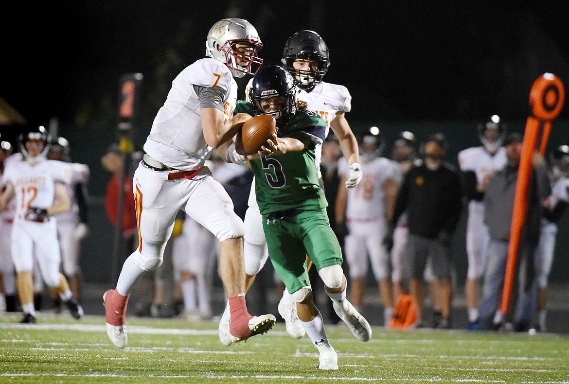 Missoula Hellgate defensive back Rollie Worster (7) intercepts a pass intended for Glacier wide receiver Drew Deck (5) in the third quarter at Legends Stadium on Friday. (Casey Kreider/Daily Inter Lake)