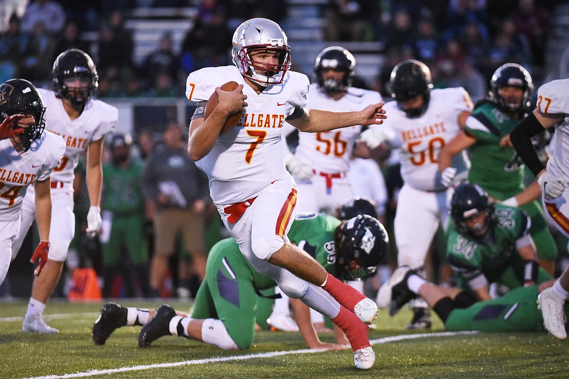 Missoula Hellgate quarterback Rollie Worster (7) looks for running room against Glacier at Legends Stadium on Friday. (Casey Kreider/Daily Inter Lake)