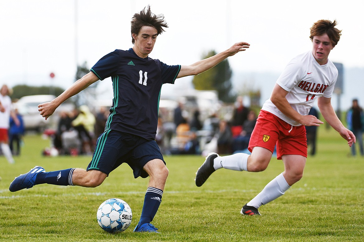 Glacier's Zane Elliott (11) looks to shoot against Missoula Hellgate defender Felix Hahn (12) at Glacier High School on Thursday. (Casey Kreider/Daily Inter Lake)