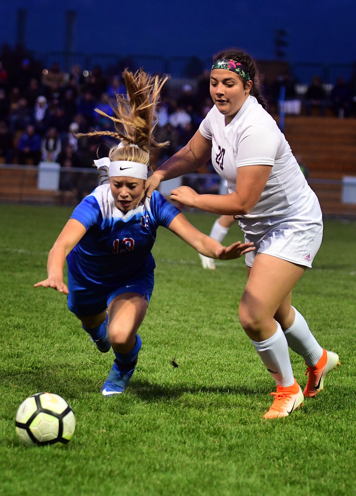 Wildkat Sydney Mann goes the ground while battling Polson's Lilly Armstrong Thursday. (Jeremy Weber/Hungry Horse News)