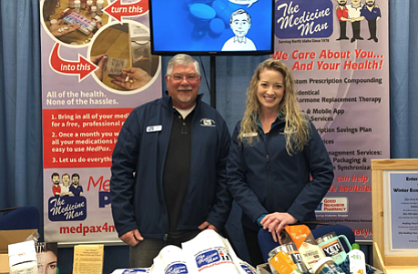 Barry Feely and marketing manager Bridget Hanna at an event booth representing Medicine Man.