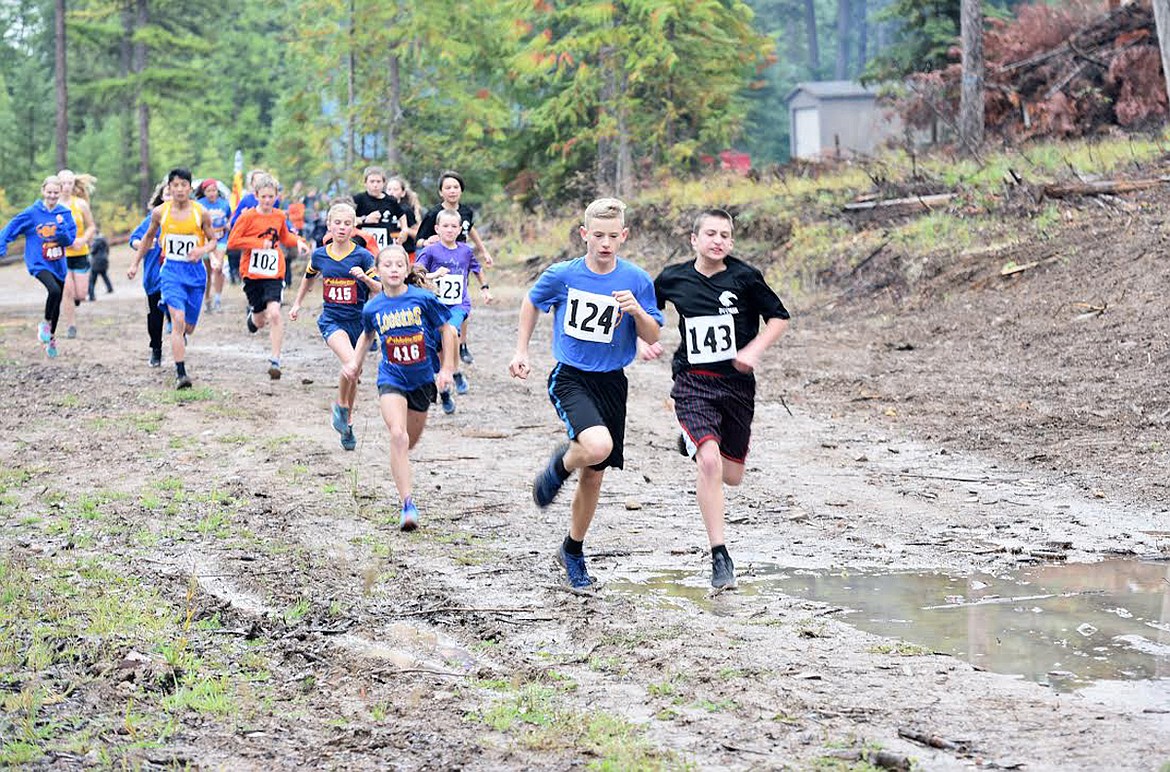 Libby eighth-grade runner Greyson Thompson (124) leads the pack for the middle school at the Wilderness Run. Thompson placed first with a time of 9:26.13. (Tana Wilson/The Western News)