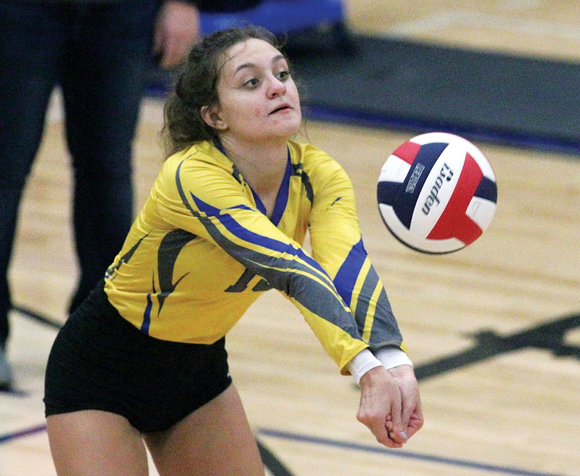 Libby sophomore outside hitter Julia Martineau passing in the third game against Browning Saturday evening. (Paul Sievers/The Western News)
