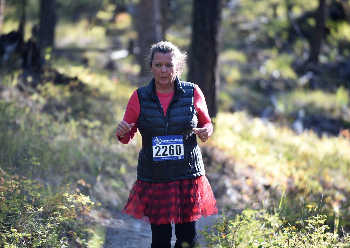 Jodi Riedel, 57, of Whitefish runs in the 5K Sunday morning during the Whitefish Trail Legacy Run. (Heidi Desch/Whitefish Pilot)