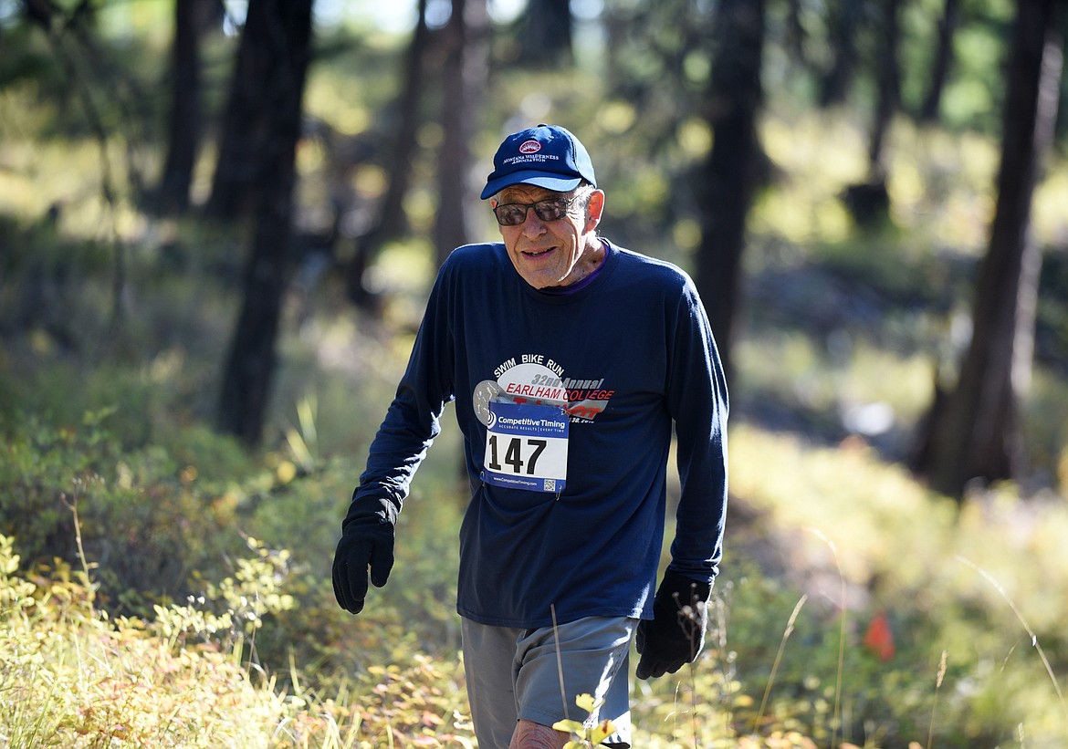 Sam Neff, 83, of Whitefish flashes a smile during the 5K race Sunday on the Whitefish Trail during the Whitefish Trail Legacy Run. (Heidi Desch/Whitefish Pilot)