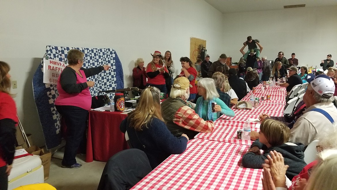 Photo by MANDI BATEMAN
Drawing the raffle tickets for the handmade quilt.