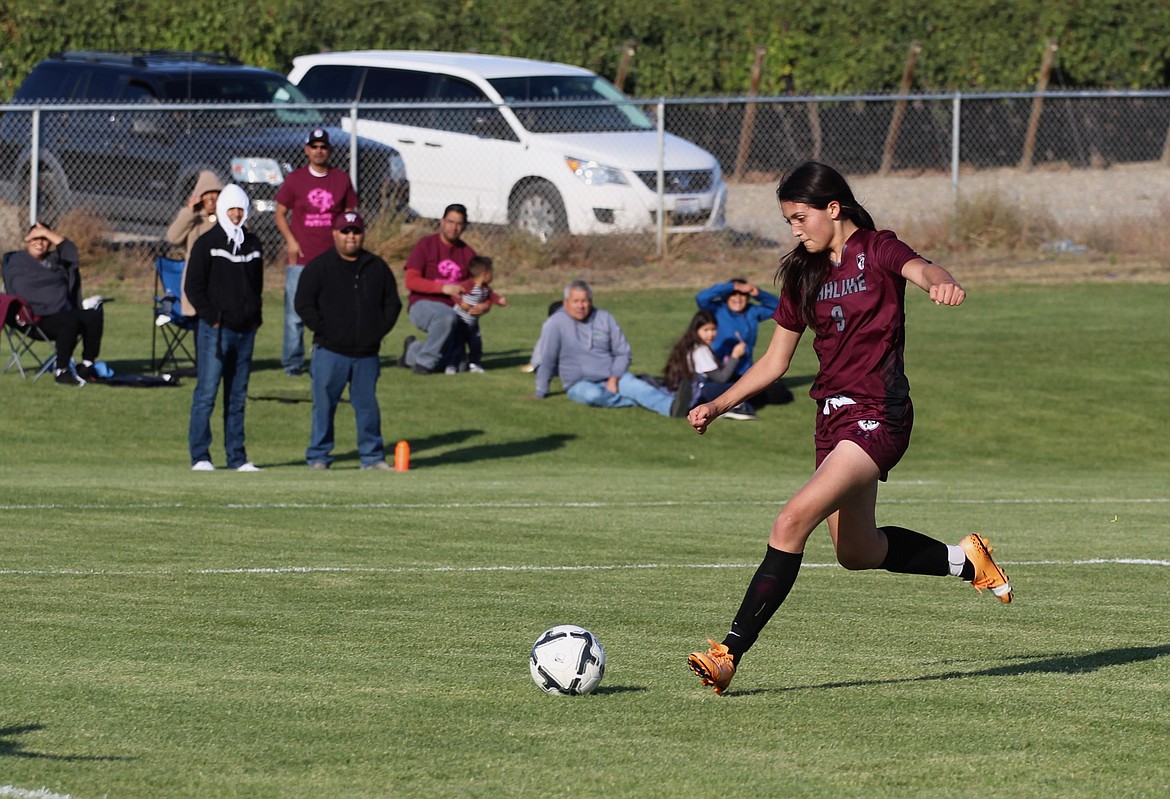 Casey McCarthy/Columbia Basin Herald Alondra Lozano fires a shot from outside the box for Wahluke. Lozano had a pair of goals in the win.