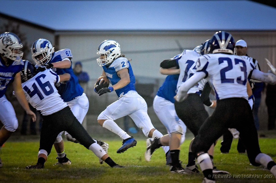 MISSION’S TROY Matt runs wih the ball against Charlo Sept. 20. (Photo courtesy Christa Umphrey, Forward Photography)