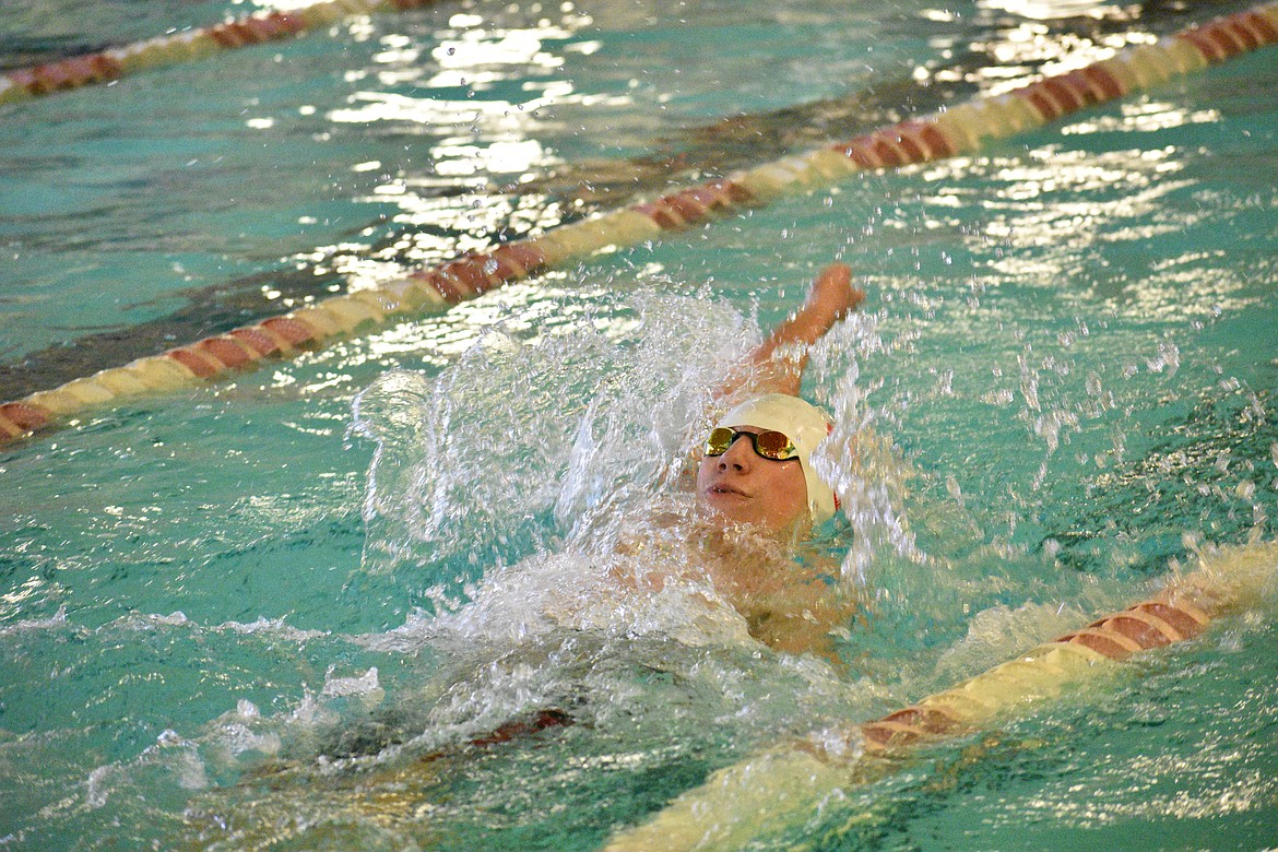 (Photo by DYLAN GREENE)
Sophomore Hayden Leavitt swims the backstroke during the boys 200 individual medley during Saturday&#146;s home meet at the Litehouse YMCA. He finished second in the event with a time of 2:32.96.