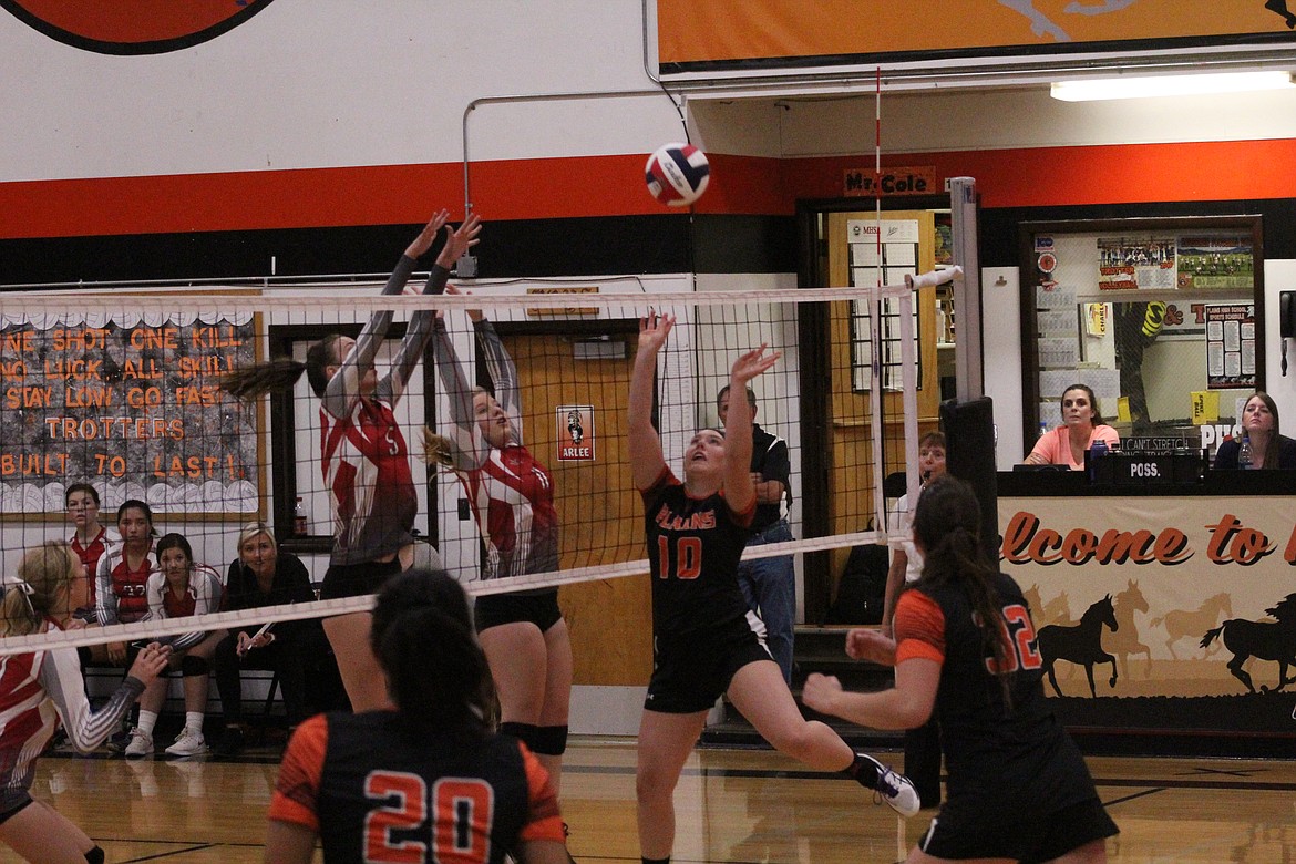 DAKOTA BUTCHER jumping to save a spike from Arlee, last Thursday. (John Dowd/Clark Fork Valley Press)