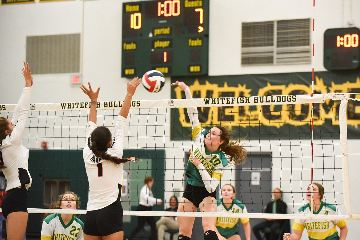 Kaiah Moore sends the ball back during Thursday&#146;s homecoming win over Ronan. (Daniel McKay/Whitefish Pilot)