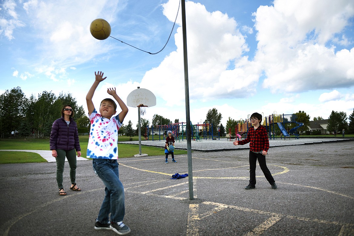 First-grade students play tether ball with teacher Shila Shreiner during recess at Edgerton Elementary School in Kalispell on Tuesday, Sept. 20. (Casey Kreider/Daily Inter Lake)