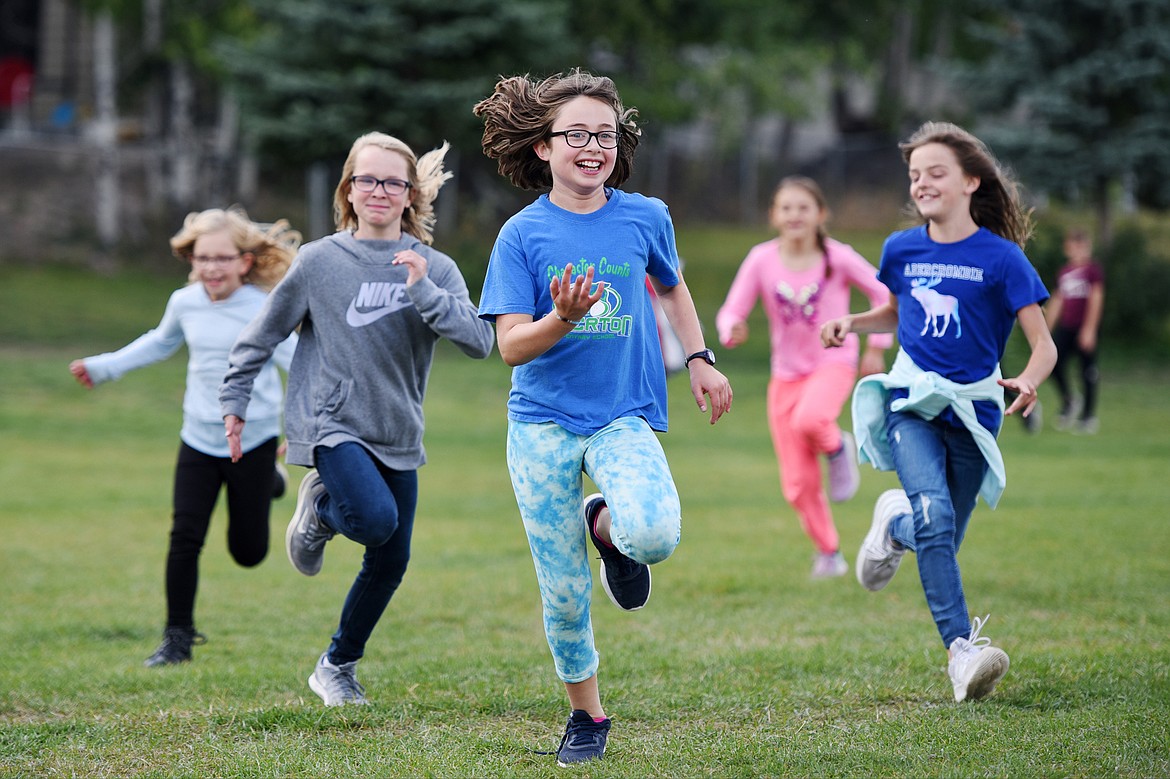 From left, third-graders Raya Gronley, Olivia Ronngren, Zia Hulebak, Addison Brisendine and Sage Witten play a game called &#147;Sharks and Minnows&#148; during recess at Edgerton.
