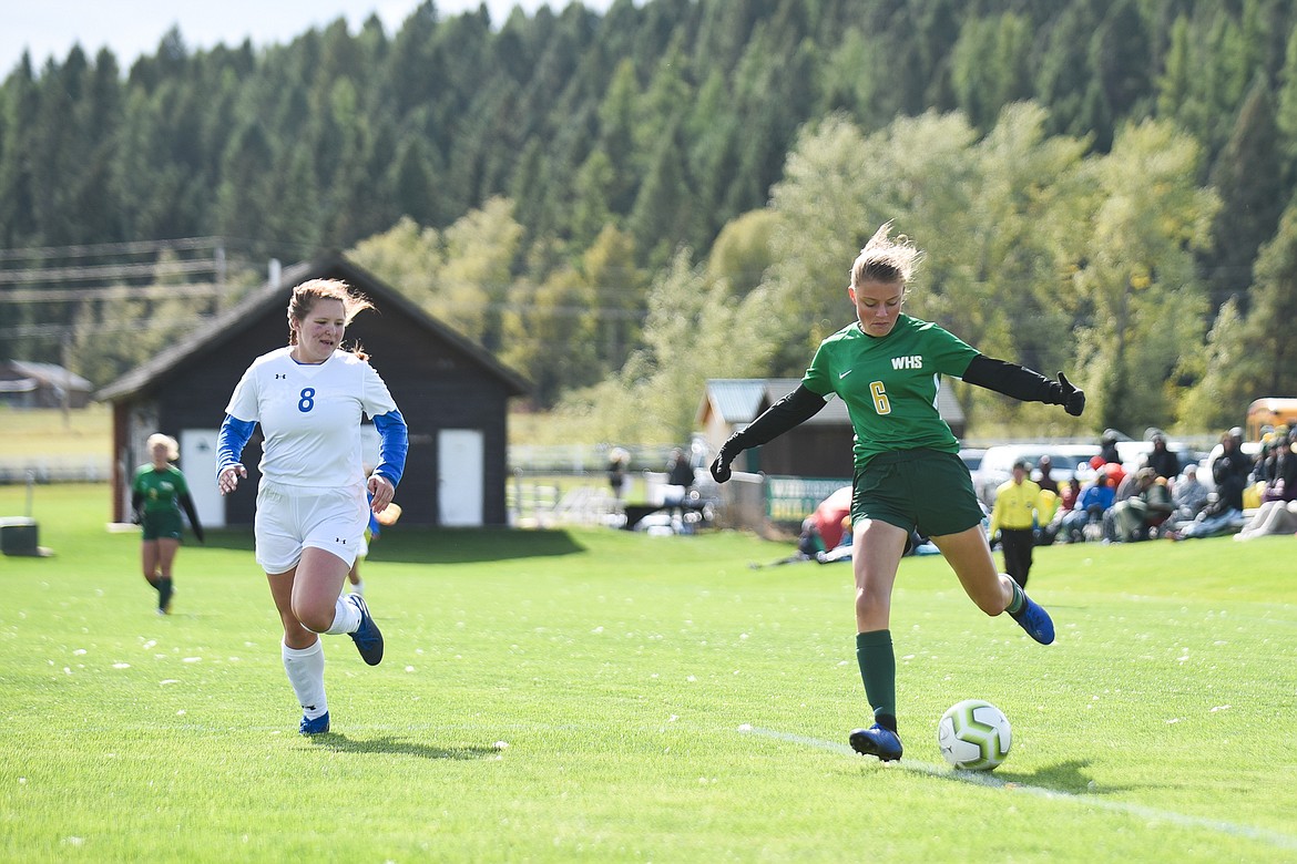 Taylor Gentry attacks the net during Saturday&#146;s homecoming win over Libby. (Daniel McKay/Whitefish Pilot)