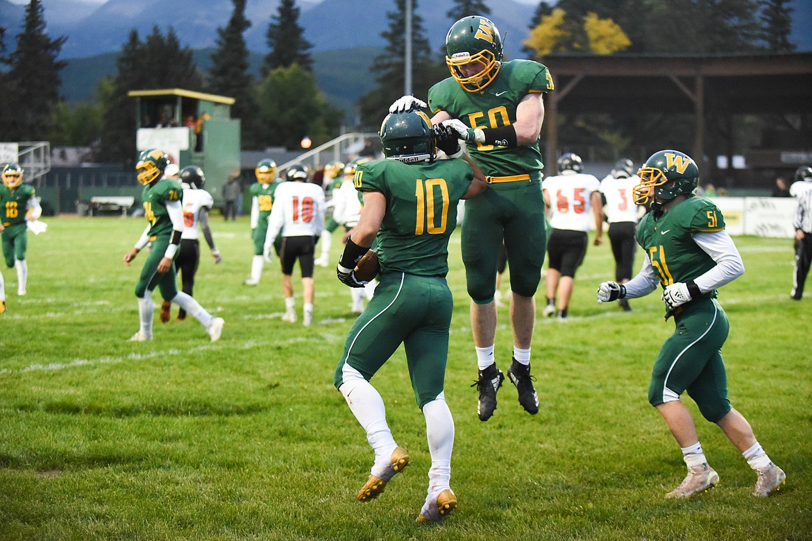 Teammates celebrate with Devin Beale after a successful two-point conversion during Friday&#146;s win over Ronan for homecoming. (Daniel McKay/Whitefish Pilot)