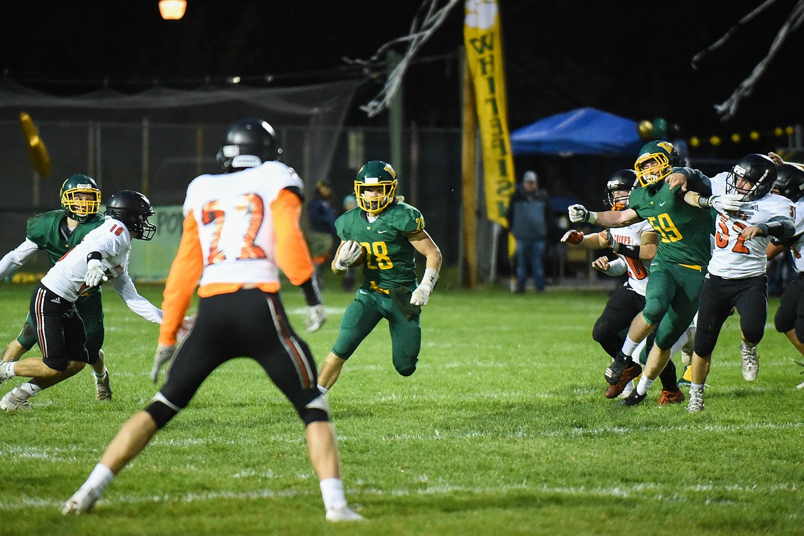 Zach Veneman makes a cut into open space during Friday&#146;s win over Ronan for homecoming. (Daniel McKay/Whitefish Pilot)