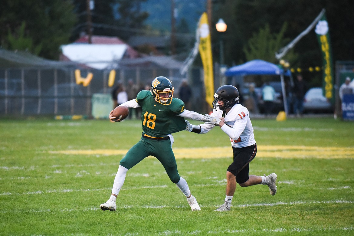 Fynn Ridgeway tries to break free from a defender during Friday&#146;s win over Ronan for homecoming. (Daniel McKay/Whitefish Pilot)