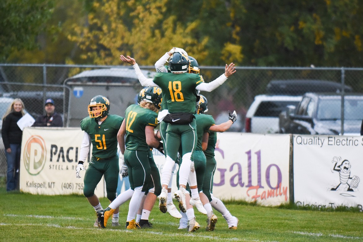 A pack of Bulldogs celebrate the first touchdown of the game during Friday&#146;s win over Ronan for homecoming. (Daniel McKay/Whitefish Pilot)