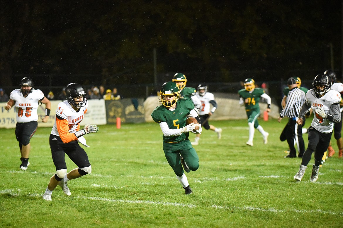 Jackson Cripe finds running room during Friday&#146;s win over Ronan for homecoming. (Daniel McKay/Whitefish Pilot)