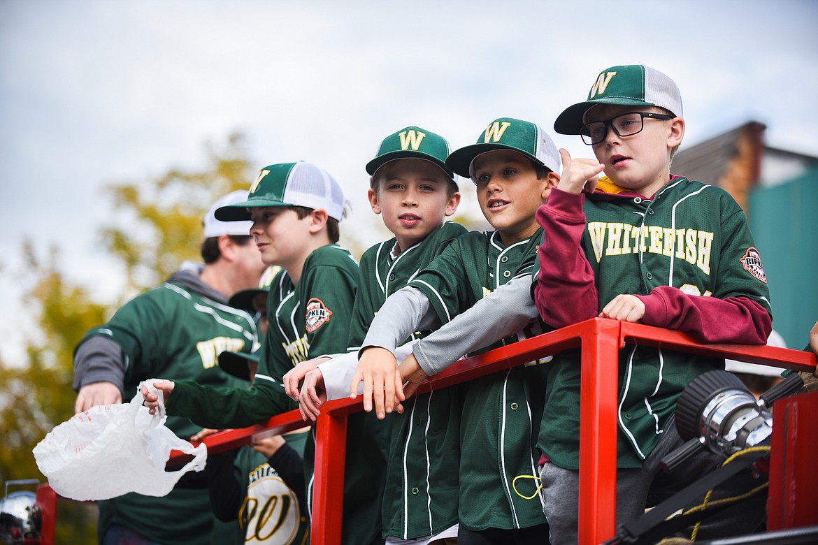 The Whitefish 10U All-Star baseball team rides on a fire truck during the parade. (Daniel McKay/Whitefish Pilot)