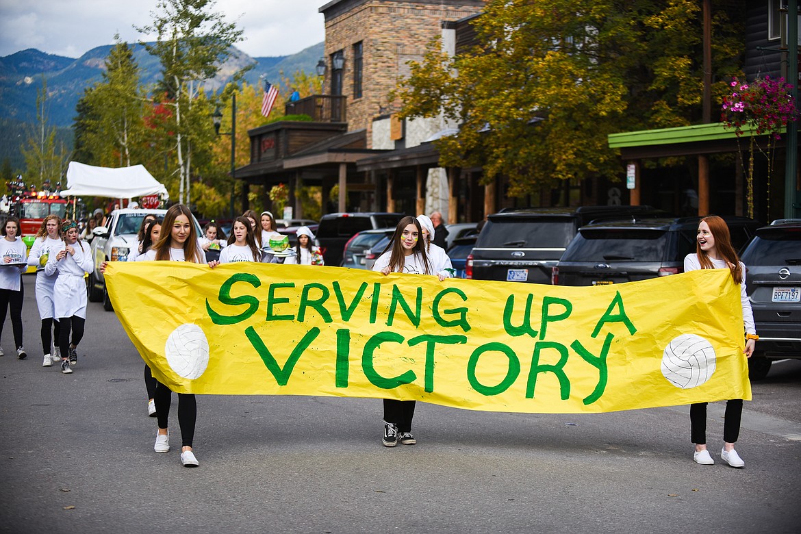 The Whitefish Lady Dogs volleyball team dressed as chefs, ready to &quot;serve up a victory,&quot; during the Homecoming parade on Friday. (Daniel McKay/Whitefish Pilot)