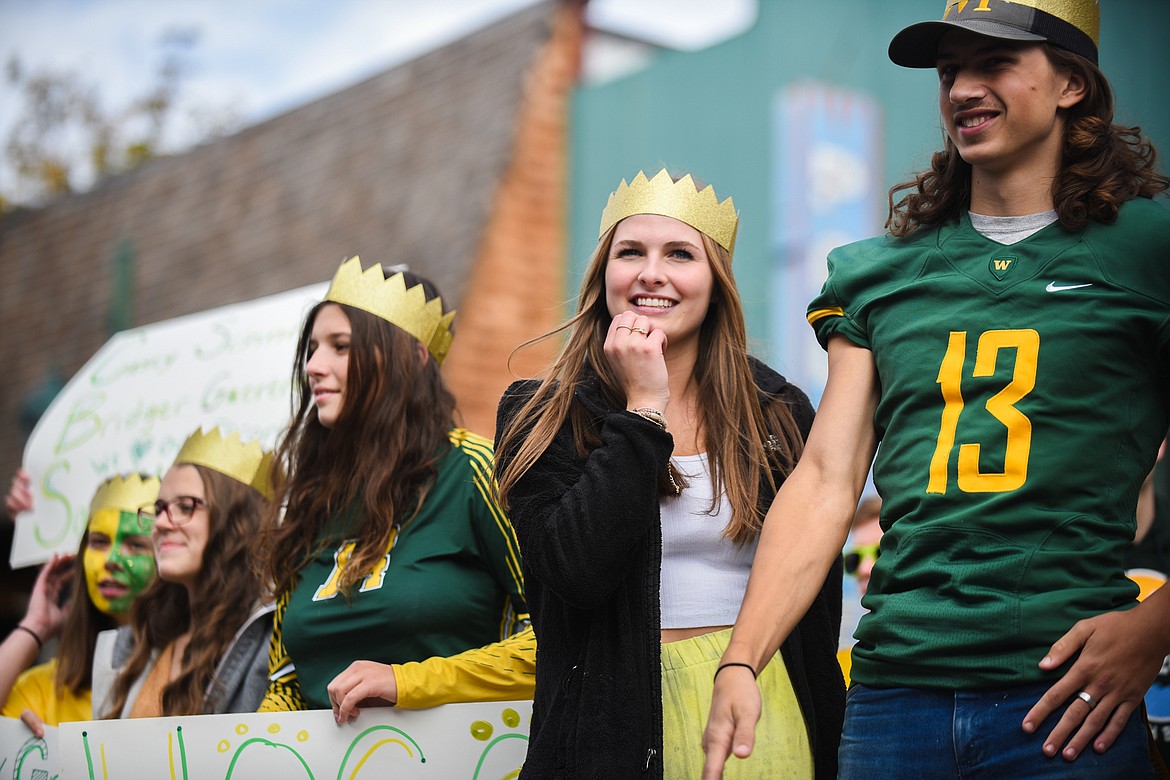 The Whitefish High School homecoming royalty smile for the crowd during the Homecoming parade on Friday. (Daniel McKay/Whitefish Pilot)