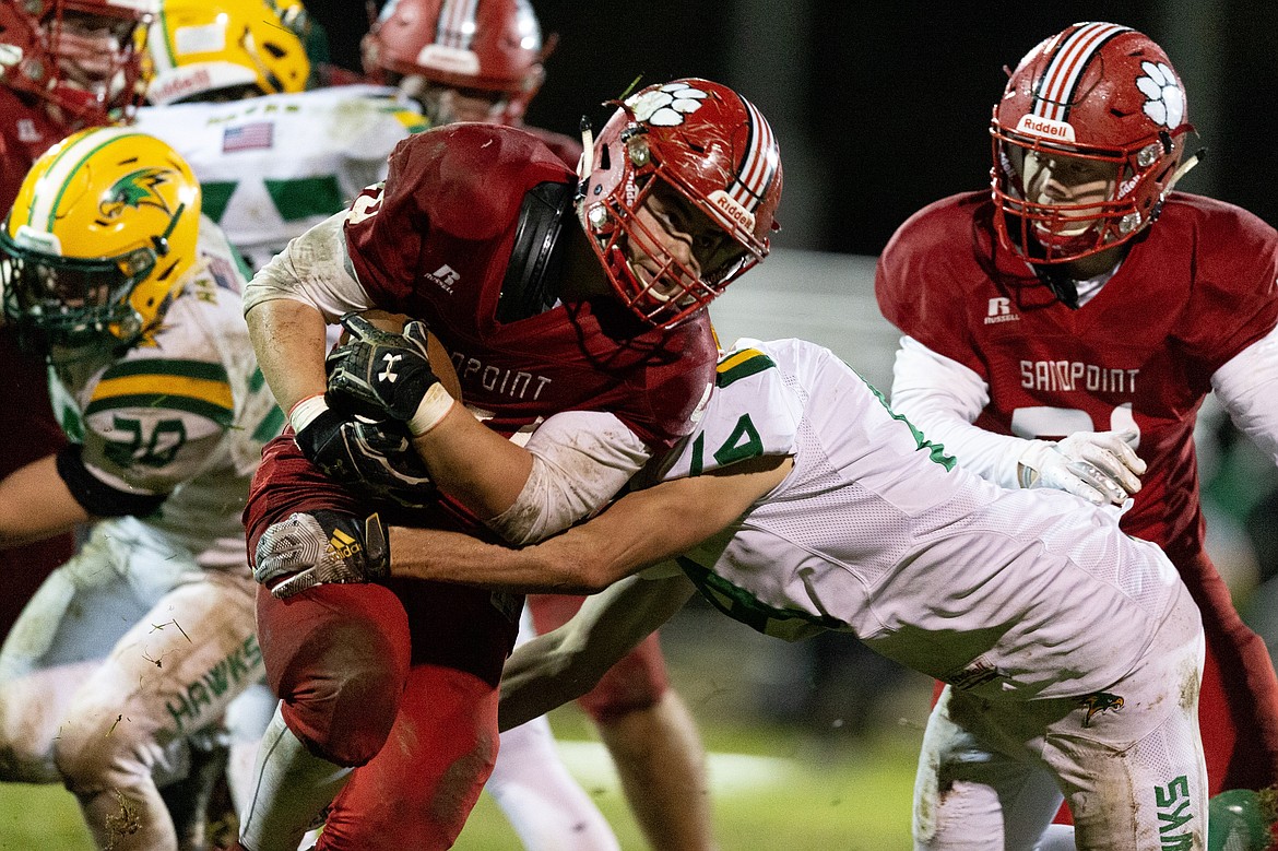 (Photo courtesy of JASON DUCHOW PHOTOGRAPHY)
Senior running back Sam Puckett plows through the heart of the Hawks defense during the fourth quarter Friday night.