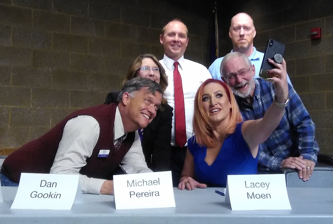 Coeur d&#146;Alene Seat 5 candidate Lacey Moen (center) orchestrates a post-forum selfie with fellow candidates (clockwise from left) Seat 3 incumbant Dan Gookin, Seat 1&#146;s Elaine Price, Seat 3&#146;s Michael Pereira, Seat 5&#146;s Tom Morgan and Seat 5 incumbant Dan English. (CRAIG NORTHRUP/Press)