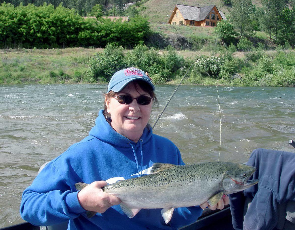 Courtesy photo
Evelyn Kaide, who has run the Guide Shop in Orofino for more than 20 years, takes time to land a spring Chinook salmon on the Clearwater River. Kaide said she has not seen such dismal steelhead returns, or weathered a closure as dire as the one this year.