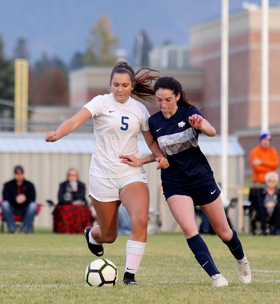 Coeur d&#146;Alene&#146;s Geneva Bengtson dribbles the ball while defended by Lake City&#146;s Sydney Harbison in the second half of the 5A Region 1 Championship game Wednesday at Lake City. (LOREN BENOIT/Press)