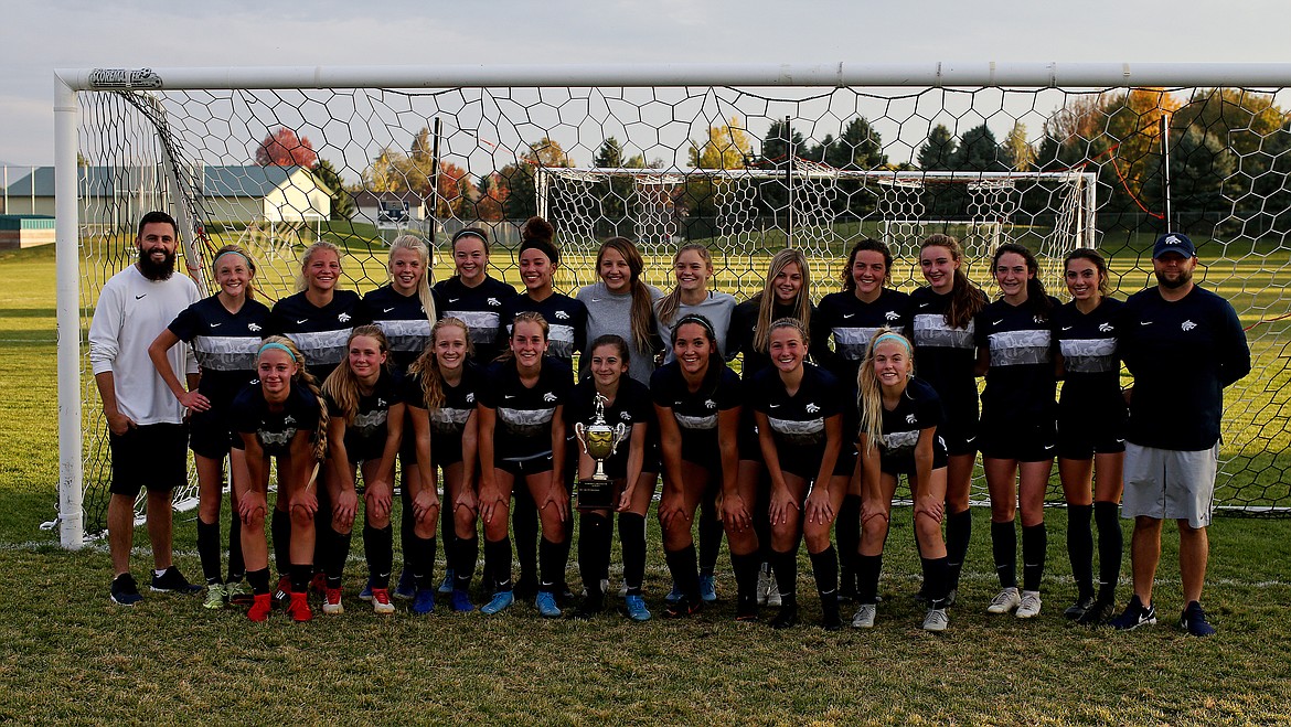 The Lake City girls soccer team gathers by the goal for pictures after defeating Coeur d&#146;Alene 3-0 in the 5A Region 1 Championship game. (LOREN BENOIT/Press)