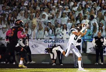 Glacier wide receiver Drew Deck (5) catches a 57-yard touchdown pass in the first quarter against Flathead during a crosstown matchup at Legends Stadium on Friday. (Casey Kreider/Daily Inter Lake)