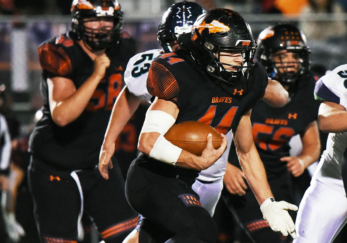 Flathead running back Tanner Russell (44) looks for room to run against Glacier during a crosstown matchup at Legends Stadium on Friday. (Casey Kreider/Daily Inter Lake)