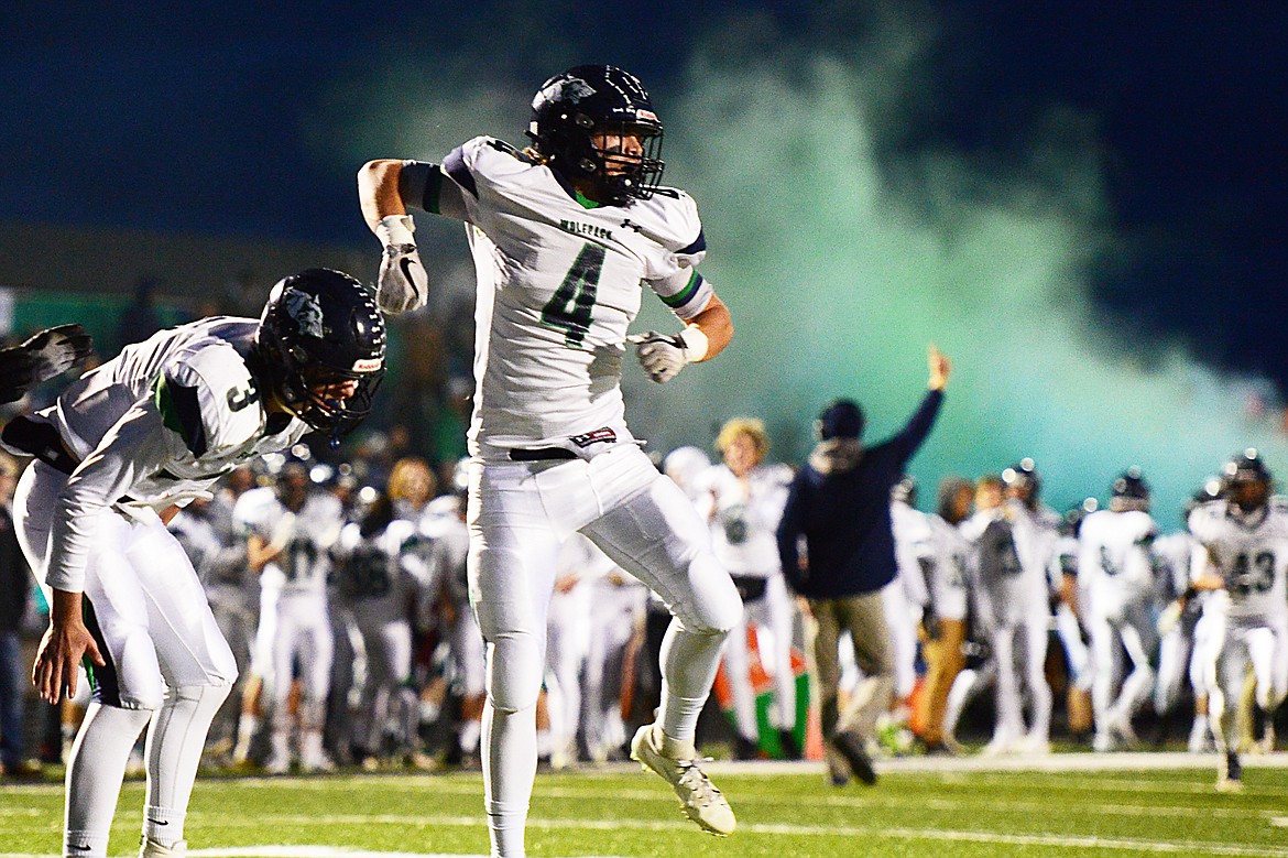 Glacier tight end Luke Bilau (4) celebrates with quarterback JT Allen (3) after a first-quarter touchdown reception by Bilau during a crosstown matchup at Legends Stadium on Friday. (Casey Kreider/Daily Inter Lake)