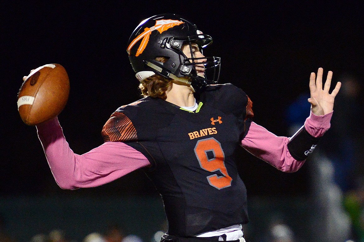 Flathead quarterback Charlie Hinchey (9) looks to throw in the first quarter during a crosstown matchup at Legends Stadium on Friday. (Casey Kreider/Daily Inter Lake)