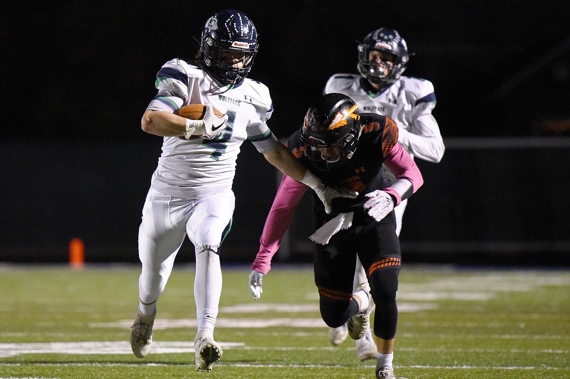 Glacier tight end Luke Bilau (4) is brought down by Flathead defender Tannen Beyl (5) after a reception during a crosstown matchup at Legends Stadium on Friday. (Casey Kreider/Daily Inter Lake)