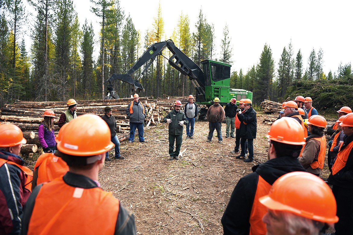 Rob Davies, center, District Ranger for the Hungry Horse-Glacier View Ranger District, speaks to a group during the Flathead Timber Tour at the Liger Timber Sale in Flathead National Forest on Thursday, Oct. 17. (Casey Kreider/Daily Inter Lake)