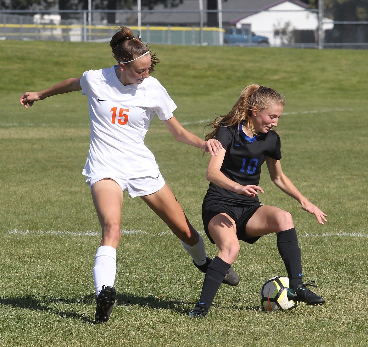 MARK NELKE/Press
Kamryn Becker, left, of Post Falls, and Zoe Cox of Coeur d&#146;Alene contend for the ball.