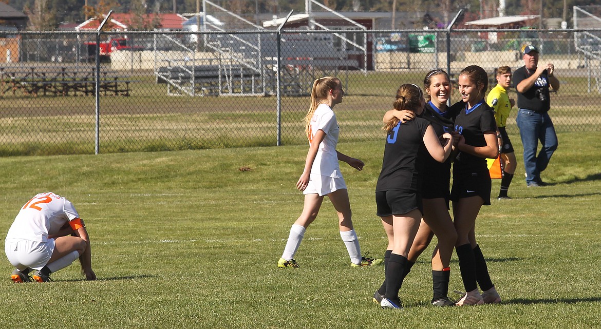 MARK NELKE/Press
Sophia Allen (3), Geneva Bengtson and Abigail Lyman of Coeur d&#146;Alene celebrate Bengtson&#146;s goal in the first half of Saturday&#146;s 5-0 victory over Post Falls in a 5A Region 1 girls soccer semifinal.