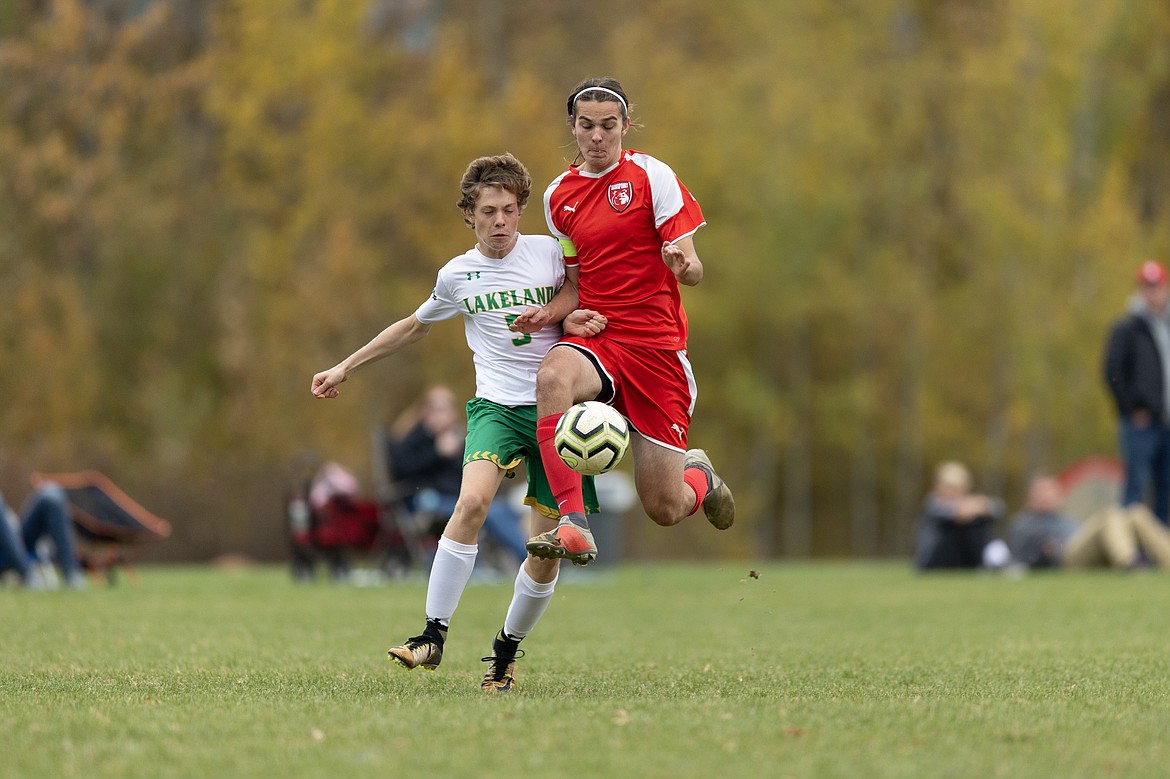 (Photo courtesy of JASON DUCHOW PHOTOGRAPHY)
Junior defender Chris Koch fights off a Lakeland player to earn possession of the ball Tuesday at Pine Street Field.