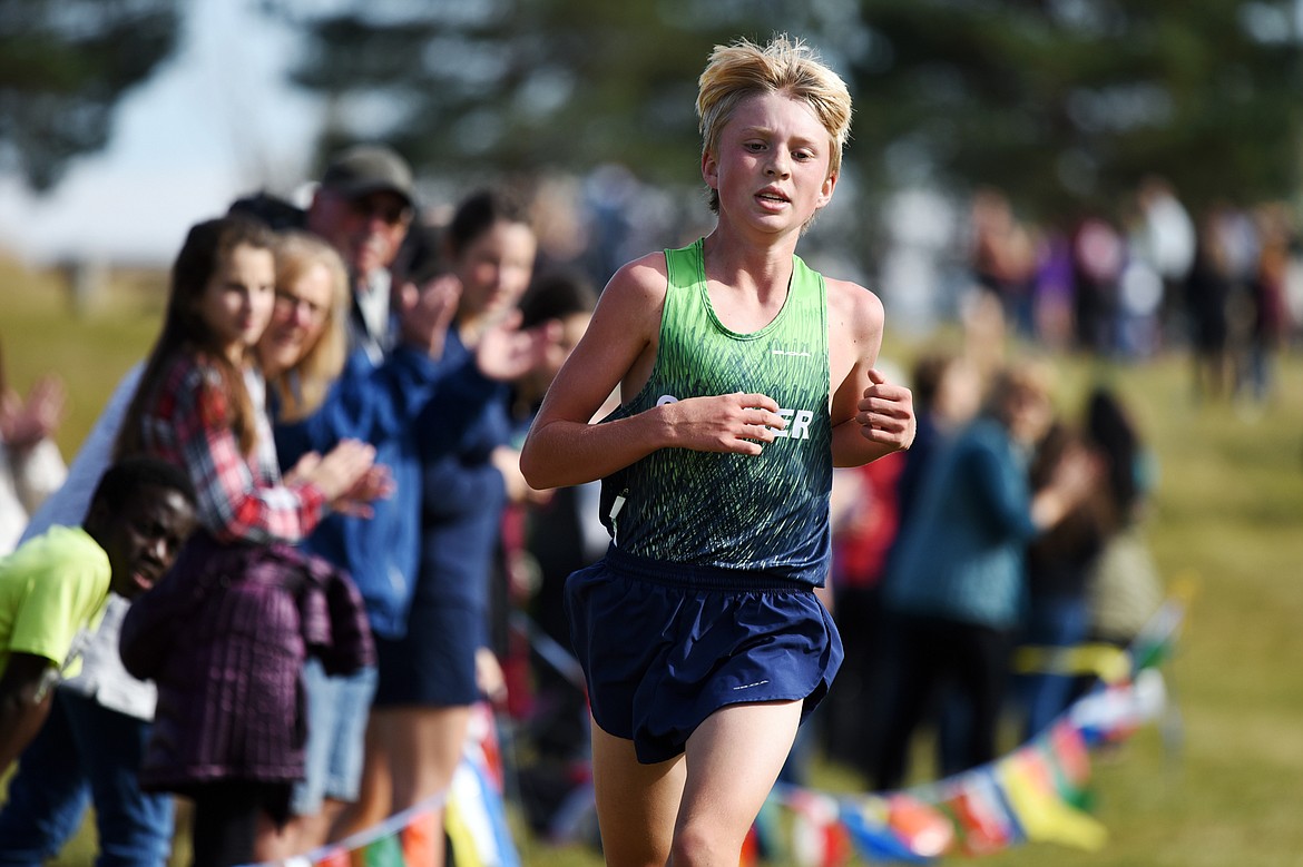 Glacier's Sam Ells crosses the finish line at the Glacier Invite at Rebecca Farm on Wednesday. Ells placed third in the boys' race. (Casey Kreider/Daily Inter Lake)